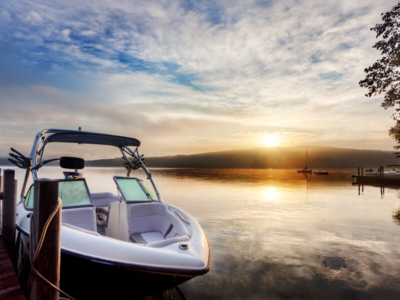 Sun and mist on boat dock at sunrise